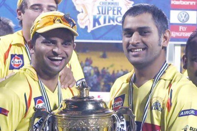 MS Dhoni, right, and Suresh Raina will be going all out to regain the trophy they won in 2011. Saurabh Das / AP Photo