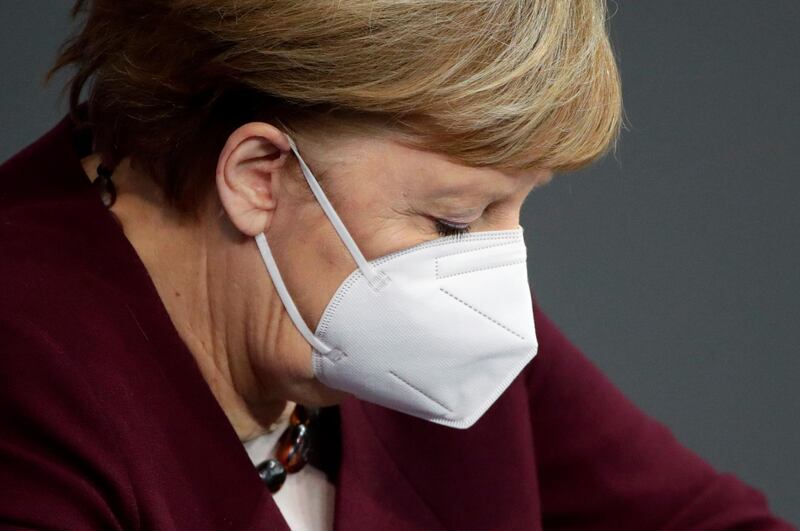 German Chancellor Angela Merkel wears a protective face mask after delivering a speech on the government's response to the Covid-19 pandemic in the country's parliament, the Bundestag, in Berlin, Germany. Reuters