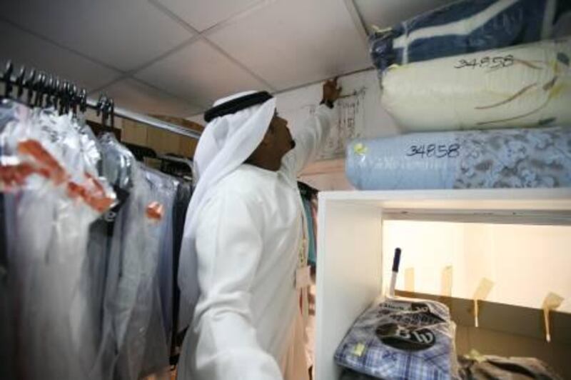 29-Dec-2011, Health Inspector, Abu Dhabi. 
The inspector Obaid Al Zaabi from Abu Dhabi Municipality public health department is moving around Abu Dhabi shops like groceries, laundries, Shipment, tailors, Saloons and many different shops with his checklist to make sure that the shops are meeting with the municipality requirements for the health and public safety. Fatima Al Marzouqi/ The National
