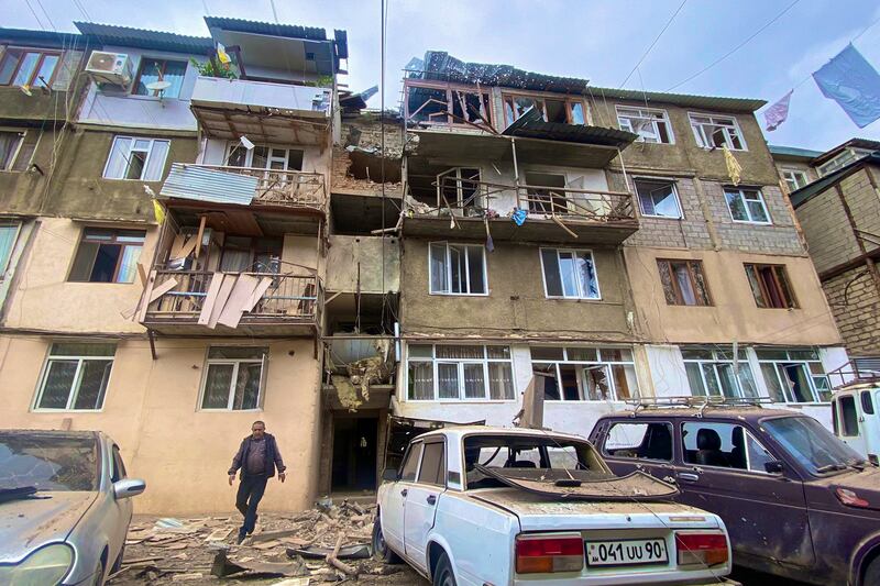 Damaged residential buildings and vehicles in Stepanakert, Nagorno-Karabakh. EPA