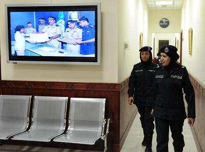 Kuwait police woman 1st Lt. Doaa Bandar, right, leaves the Police HQ in South Surra, Kuwait to go on patroll duty on Wednesday, September 2nd 2010.(Photo:Gustavo Ferrari/The National) 