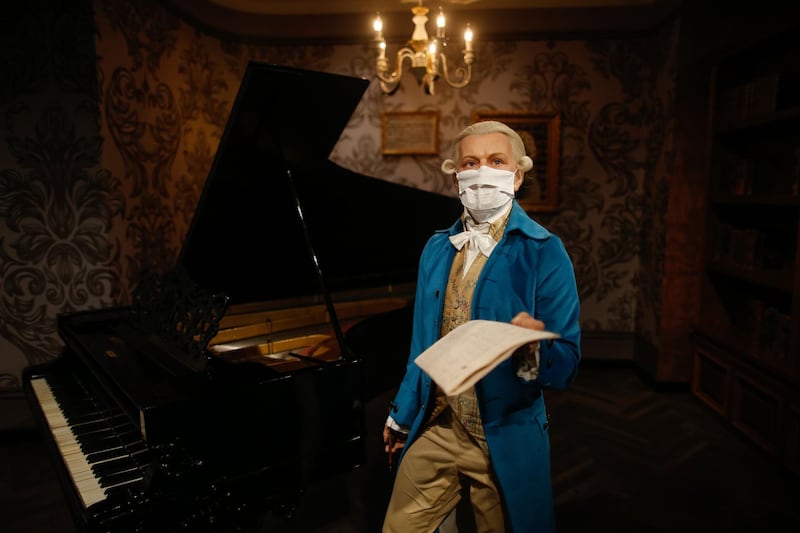 In order to raise awareness against the spread of the coronavirus, a mask is placed on the wax figure of Wolfgang Amadeus Mozart at Madame Tussauds museum in Istanbul. AP Photo