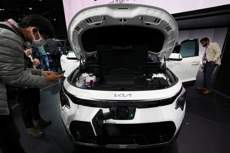Attendees take in the 2023 Kia Niro EV at the 2022 New York International Auto Show. Reuters