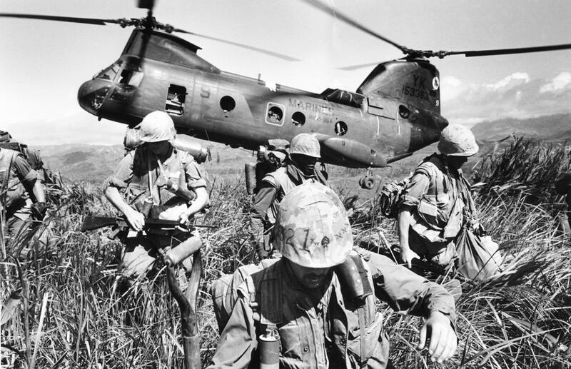 U.S. Marines leave a helicopter to search the hills near a former U.S. base at Khe Sanh in South Vietnam in Oct. 1968 during the Vietnam War. AP Photo