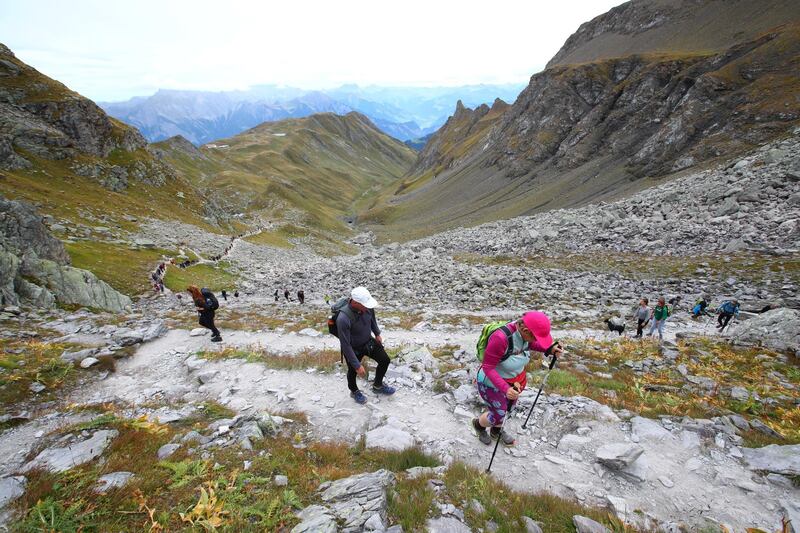 People climb to take part in the mourning ceremony for the disappearing Pizol glacier, in Mels, Switzerland. Reuters