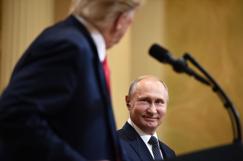 TOPSHOT - US President Donald Trump and Russia's President Vladimir Putin attend a joint press conference after a meeting at the Presidential Palace in Helsinki, on July 16, 2018.  / AFP / Brendan SMIALOWSKI
