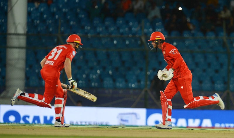 Islamabad United's Alex Hales, right, and Martin Guptill run between the wicket at the National Cricket Stadium in Karachi. EPA