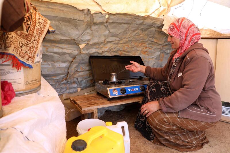 A Bedouin woman prepares coffee in her tent in the village of Humsah al-Baqia, in the Israeli-occupied West Bank. Humsah al-Baqia falls in the so-called 'Area C', occupied Palestinian territory, which is under full Israeli control. AFP