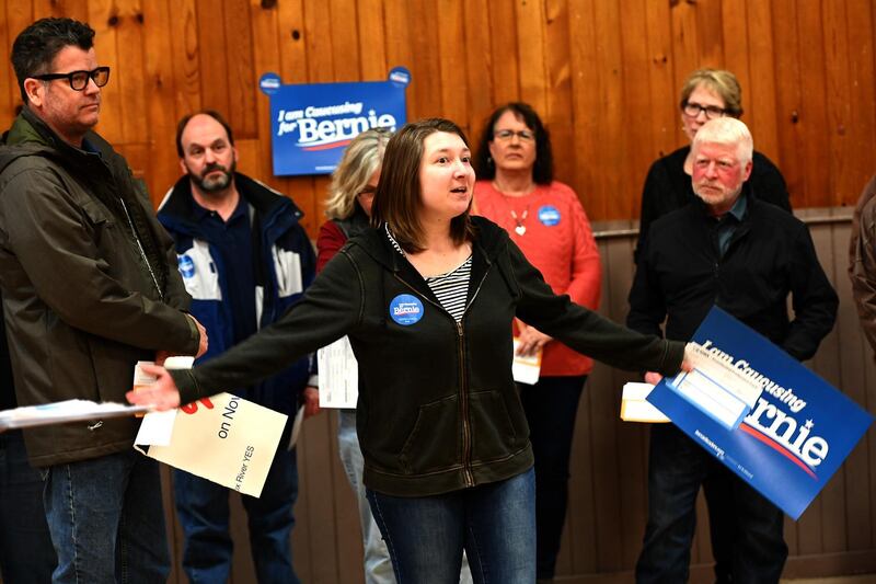 Supporters of Democratic presidential candidate, Bernie Sanders plead their case in Carpenter, Iowa.   Getty Images