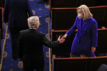 Republican Senator Mitch McConnell greets Congresswoman Liz Cheney before US President Joe Biden's address to a joint session of Congress last week. (AFP) 