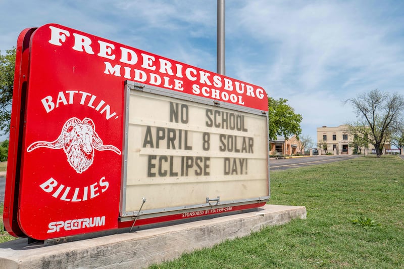 A sign in Fredericksburg, Texas, reminds parents and pupils that school is closed for the solar eclipse. Getty Images / AFP 
