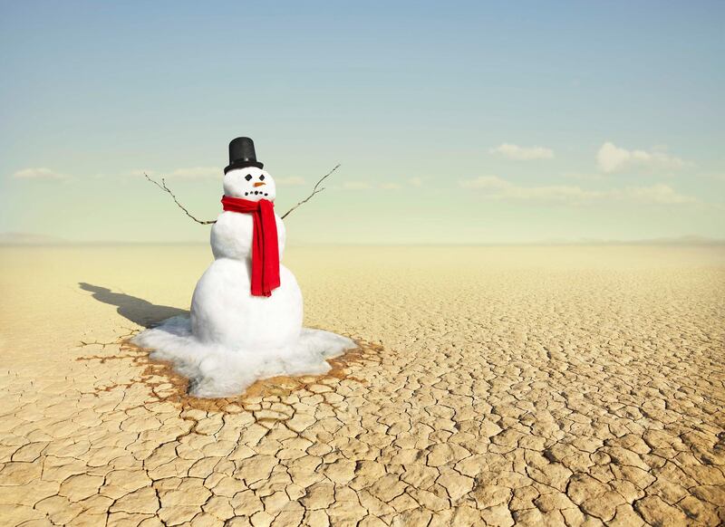A classic snowman built and photographed at Cuddyback dry lake bed in the Mojave desert California, USA.  Photographed with a Canon 1DS Mark II. Getty Images