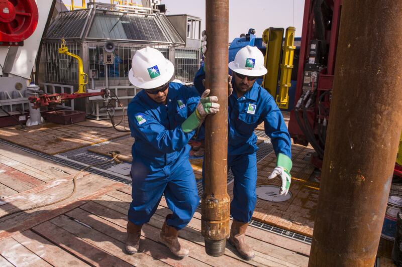 epa08046344 A handout image made available by Saudi Arabian oil company Saudi Aramco on 05 December 2019, showing Saudi Aramco workers at an onshore rig at a undisclosed location in Saudi Arabia on 17 November 2019. Saudi Aramco that is due to go public at the Tadawul stock exchange in Riyadh, Saudi Arabia, in mid-December, is expected to announce the final price for its initial public offering on 05 December 2019. The IPO could become world's biggest initial public offering ever if it exceeds the 2014 IPO of Alibaba that raised 25 billion USD.  EPA/SAUDI ARAMCO HANDOUT  HANDOUT EDITORIAL USE ONLY/NO SALES