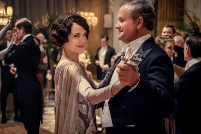 This image released by Focus Features shows Elizabeth McGovern, left, as Lady Grantham and Hugh Bonneville, as Lord Grantham, in "Downton Abbey". The original principal cast of â€œDownton Abbeyâ€ are returning for a second film that will arrive in theaters December 22 this year, Focus Features announced Monday. â€œDownton Abbeyâ€ creator Julian Fellowes has written the screenplay, and Simon Curtis is directing. (Jaap Buitendijk/Focus Features via AP)