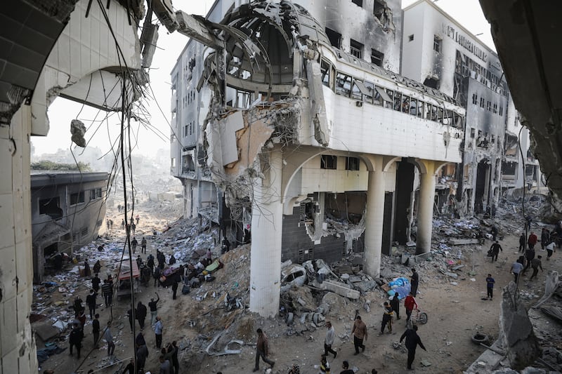 Palestinians inspect the damage at Al Shifa Hospital after Israeli forces withdrew from it following a two-week operation. Reuters
