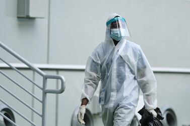 A stadium worker in a hazmat suit at the Al Janoub Stadium in Qatar. Getty Images