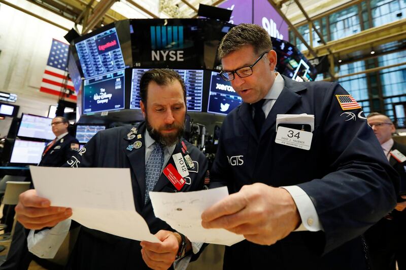 FILE - In this May 14, 2019, file photo specialists Michael Pistillo, left, and David Haubner confer on the floor of the New York Stock Exchange. The U.S. stock market opens at 9:30 a.m. EDT on Thursday, June 6. (AP Photo/Richard Drew, File)