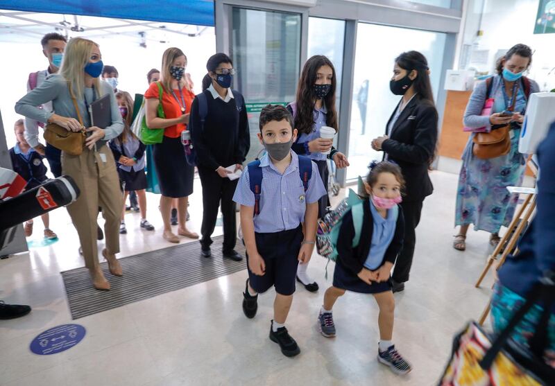 Abu Dhabi, United Arab Emirates, February 16, 2021.  Pupils return to school on Sunday at British School Al Khubairat.  --  Parents, teachers and students pass security before entering the school.
Victor Besa/The National
Reporter:  Haneen Dajani
Section:  NA