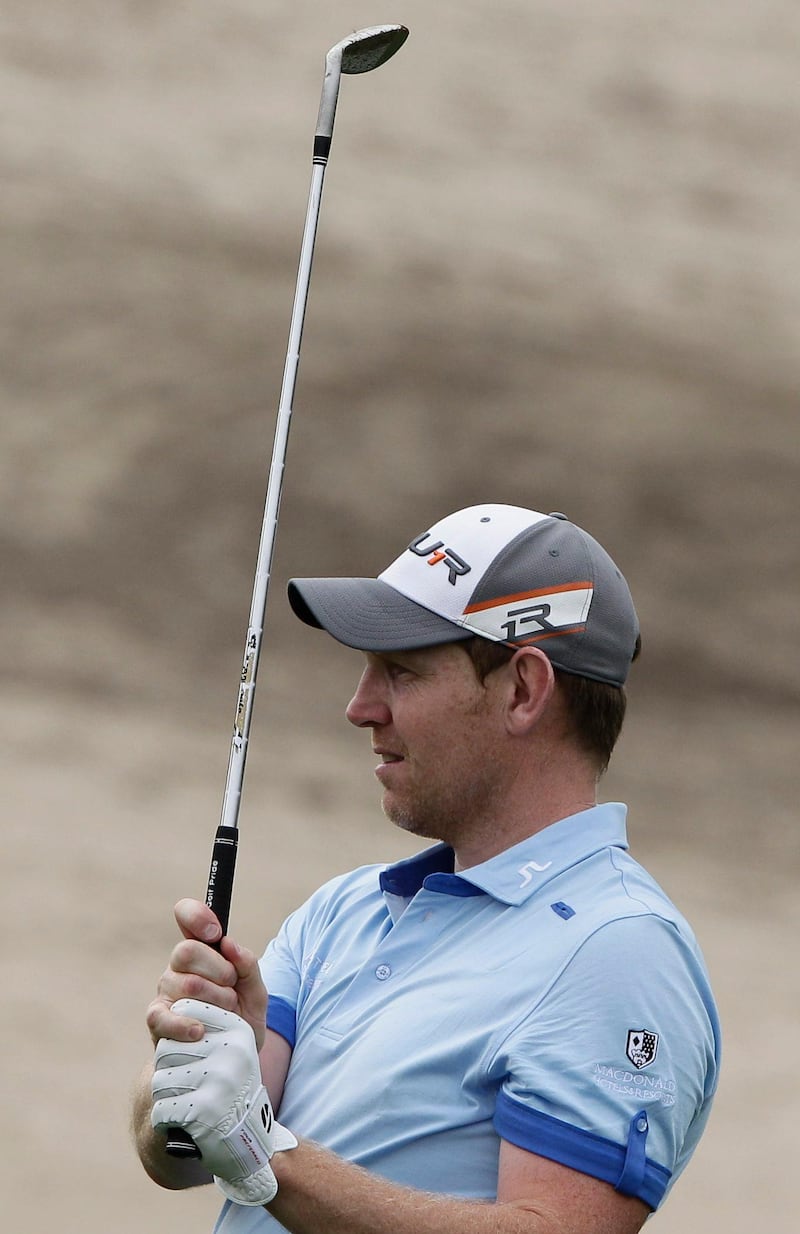 Stephen Gallacher of Scotland follows his ball on the 17th hole during the second round of the Dubai Desert Classic Golf tournament in Dubai, United Arab Emirates, Friday, Feb. 1, 2013. (AP Photo/Kamran Jebreili) *** Local Caption ***  Mideast Emirates Golf Desert Classic.JPEG-09bbf.jpg