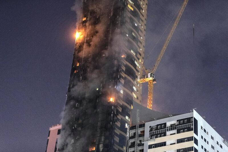 SHARJAH, UNITED ARAB EMIRATES. 05 MAY 2020. STANDALONE. Fire at the Abbco Tower near Nahda Park in Sharjah. Police and fire fighters responded to a blaze that was reported after 8:30. (Photo: Antonie Robertson/The National) Journalist: Salam Al Amir. Section: National.