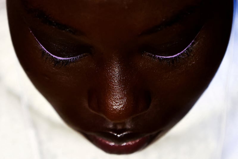 A model sits backstage after having make-up applied before the Carolina Herrera Fall/Winter show during New York Fashion Week. Reuters