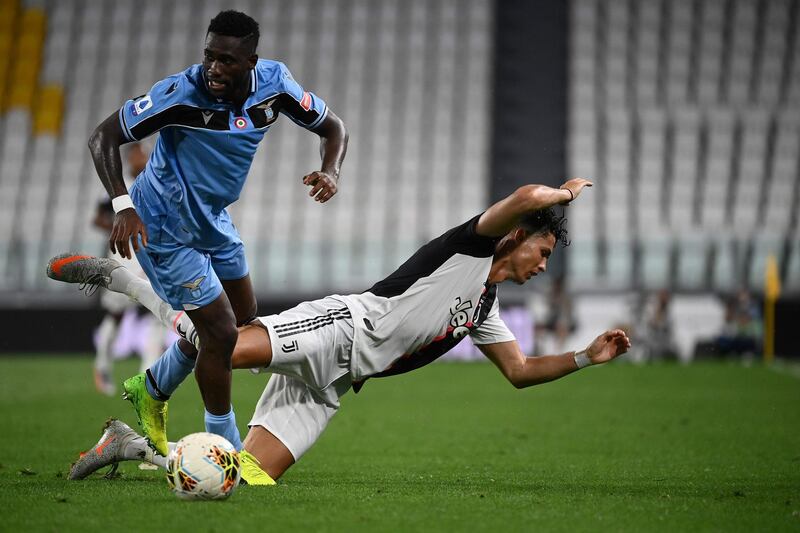 Lazio's Dutch forward Bobby Adekanye fights for the ball with Juventus' Portuguese forward Cristiano Ronaldo. AFP