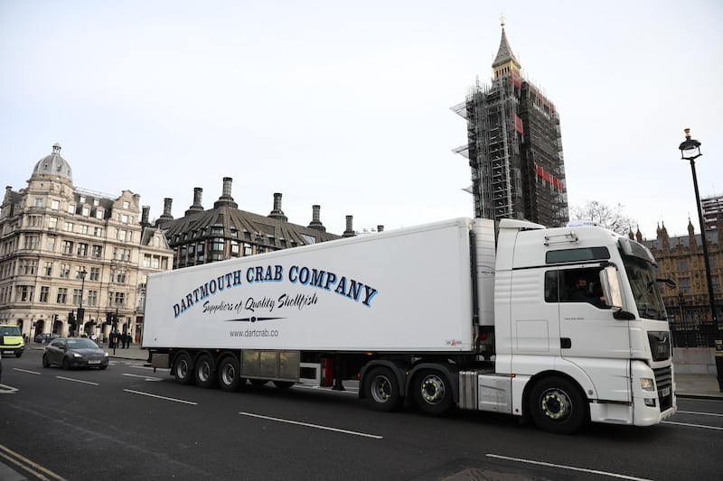 A lorry from Dartmouth Crab Company drives past the Houses of Parliament. Getty Images