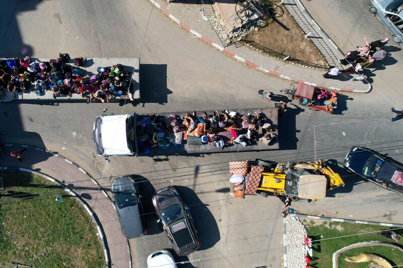 Palestinians have formed convoys to flee northern Gaza. AP