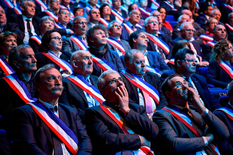 Mayors listen as they take part in a conference gathering mayors from Brittany, in Saint-Brieuc, western France. AFP