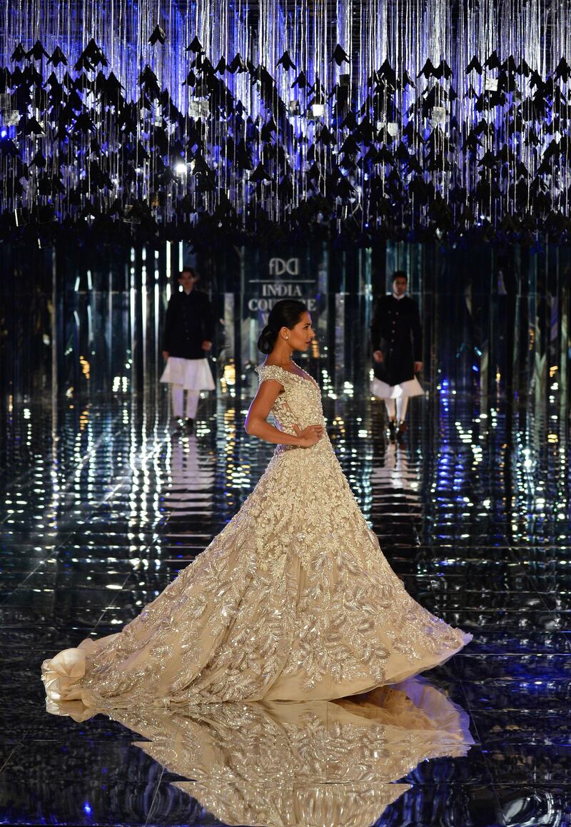 Malhotra opted for luxurious fabrics, including silks, velvets, satin and tulle, to retain his innate opulence in this modern-day bridal-wear collection. AFP
