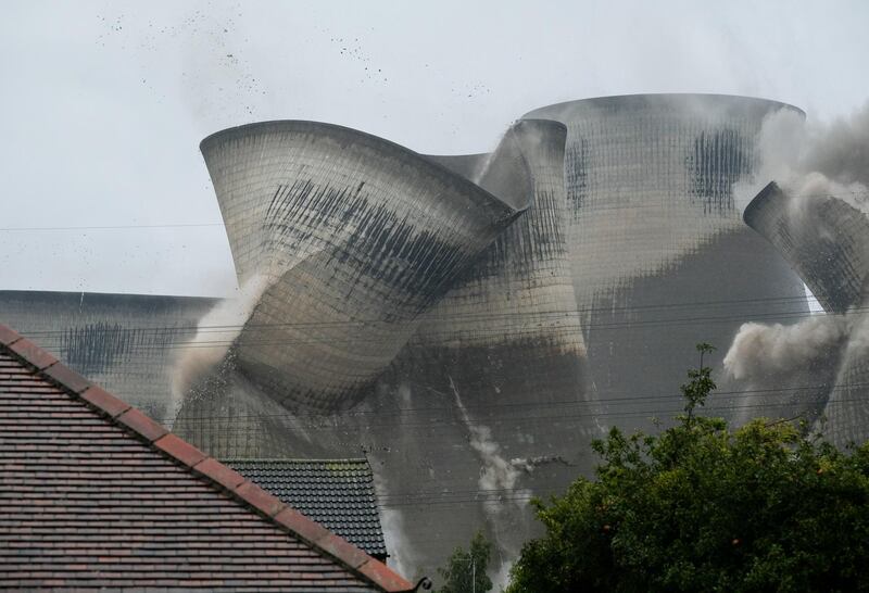 Four of the iconic cooling towers at the Ferrybridge C Power station are demolished in Knottingley, England. More than 140 people were evacuated from their homes during the demolition.  Getty