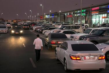 Illegally parked cars at Al Shamkha, near Abu Dhabi Airport. Police have reminded drivers that leaving a car idling is a finable offence. Silvia Razgova / The National