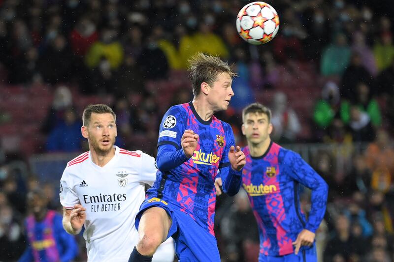 Barcelona's Dutch midfielder Frenkie De Jong heads the ball. AFP