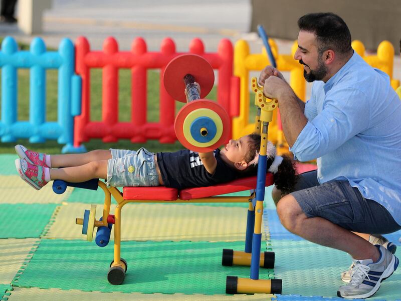 Dubai, United Arab Emirates - October 26, 2018:  Mohammad and his daughter Naya aged 2 lift kids weights at the Dubai Fitness Challenge. The Crown Prince of Dubai renews his emirate-wide call for every resident to take part in 30 minutes of exercise for 30 days. Friday, October 26th, 2018 Festival City Mall, Dubai. Chris Whiteoak / The National