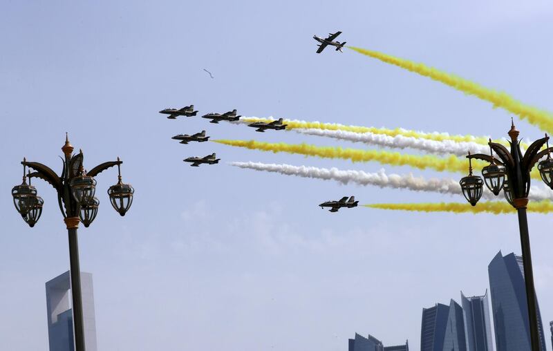 Jets spray the skies in the Vatican colours of yellow and white over the Corniche. Reuters