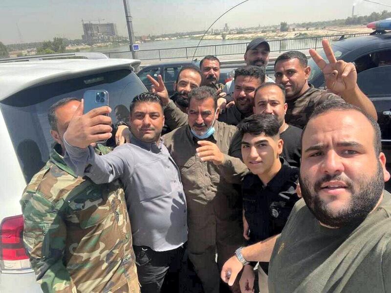 Iraqi militia commander Qassim Musleh is pictured with supporters following his release from Iraqi government custody.