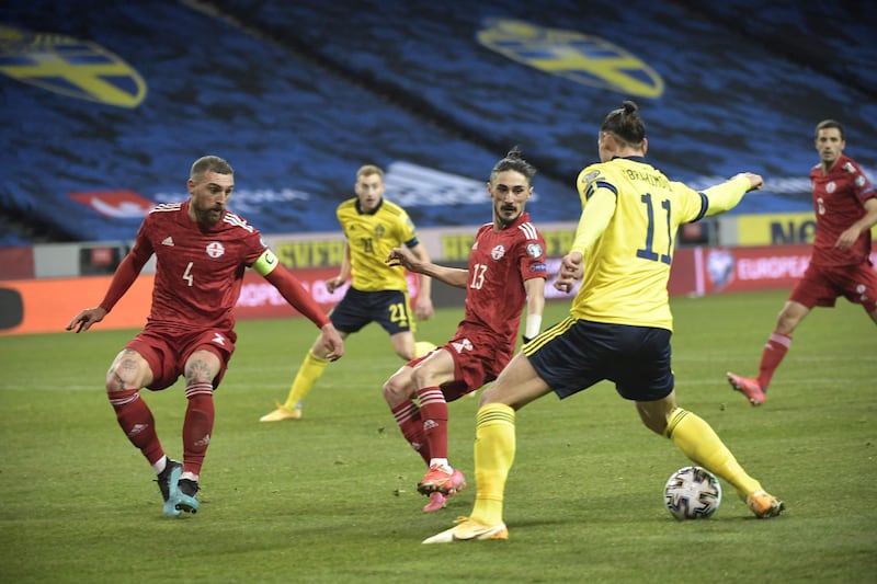 Sweden's Zlatan Ibrahimovic is closed down by Guram Kashia and Grigol Chabradze of Georgia. AFP