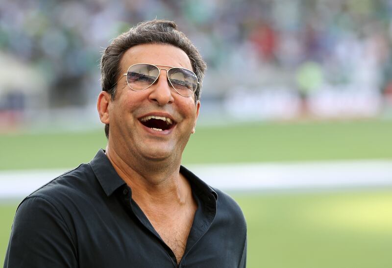 Pakistan legend Wasim Akram smiles to the crowd before the game. 
