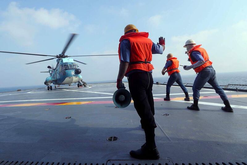 An Iranian army helicopter landing on a navy warship during the last day of a military exercise in the Gulf. AFP, HO via Iranian Army website