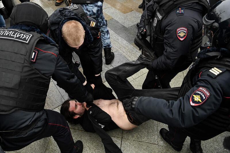 Police detain a man during a rally in support of jailed opposition leader Alexei Navalny in downtown Moscow. AFP