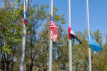 Emirati astronauts Hazzaa Al Mansoori and Sultan Al Neyadi raise the UAE flag at a ceremony at Baikonur Cosmodrome on Thursday ahead of their mission to the ISS on September 25. WAM