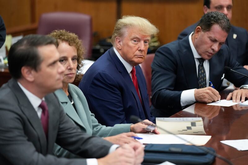 Donald Trump sits with his defence team in a Manhattan court in April 2023. AP