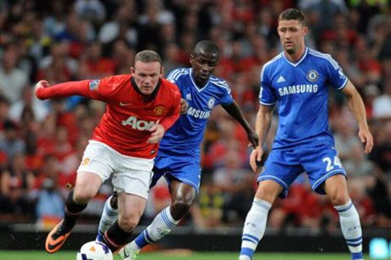 Wayne Rooney, left, was a part of the Manchester United side that faced Chelsea at Old Trafford on Monday night. Peter Powell / EPA