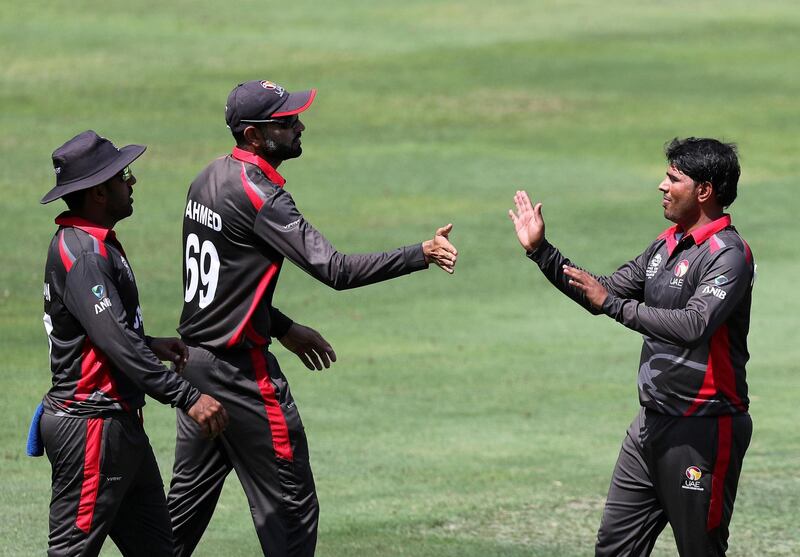 Dubai, United Arab Emirates - October 14, 2019: The UAE's Waheed Ahmed takes the wicket of Scotland's Oli Hairs during the ICC Mens T20 World cup qualifier warm up game between the UAE and Scotland. Monday the 14th of October 2019. International Cricket Stadium, Dubai. Chris Whiteoak / The National