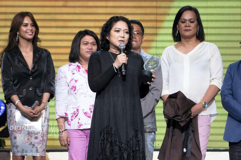 Harlene Bautista picked up the trophy for Movie of the Year: Rainbow's Sunset. Photo by Dion Besa