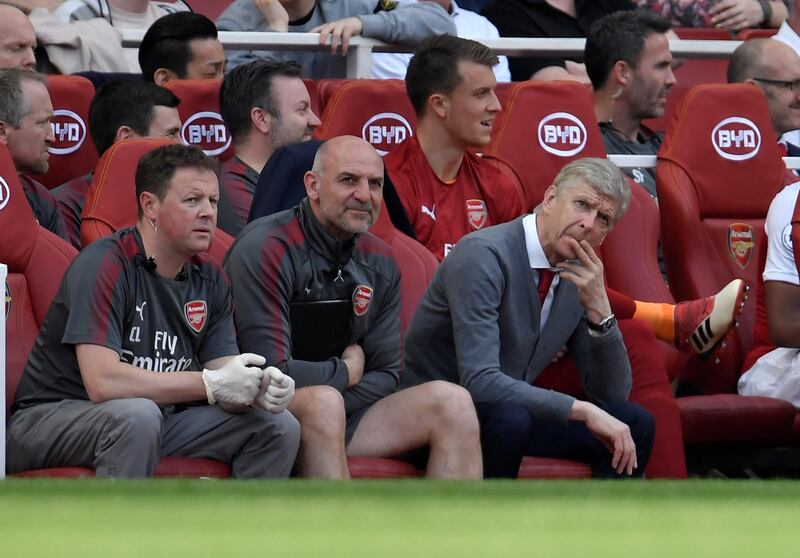 Arsenal manager Arsene Wenger and assistant manager Steve Bould on the bench. Toby Melville / Reuters