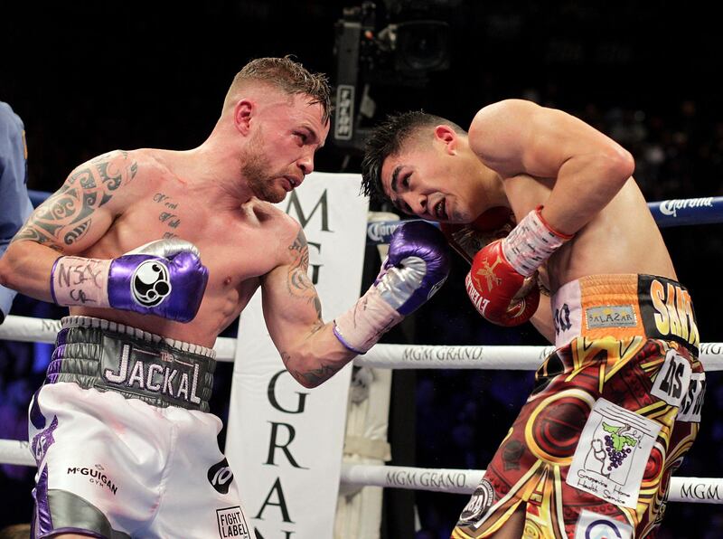 Carl Frampton, IRE., and Leo Santa Cruz, USA fight for WBC Super Featherweight title at the MGM Grand Arena in Las Vegas on January 28, 2017. - Santa Cruz won a majority decision. (Photo by John Gurzinski / AFP)