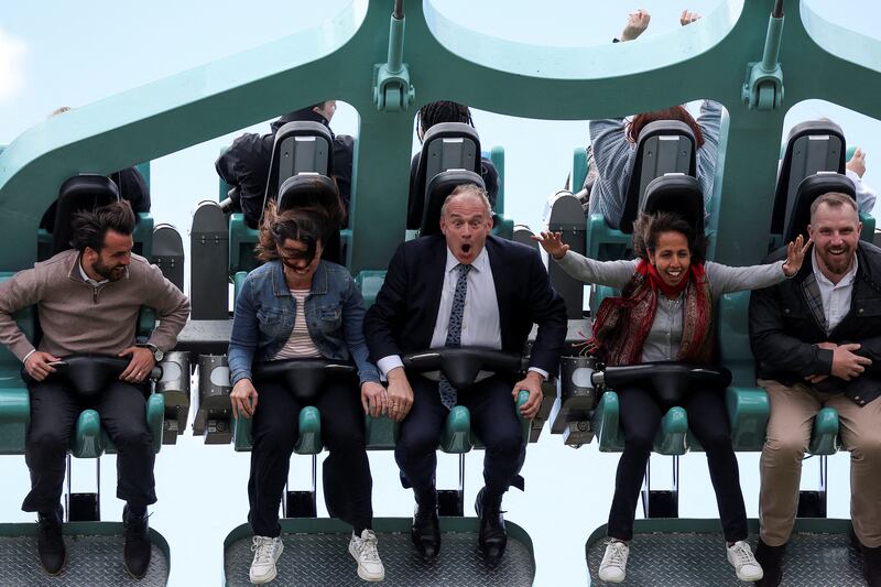 Leader of the Liberal Democrats Ed Davey sits on a ride called 'Rush' during a general election campaign event at Thorpe Park in London. Reuters