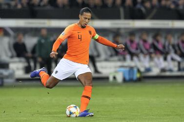 HAMBURG, GERMANY - SEPTEMBER 06: Virgil Van Dijk of Netherlands runs with the ball during the UEFA Euro 2020 qualifier match between Germany and Netherlands at Volksparkstadion on September 06, 2019 in Hamburg, Germany. (Photo by Alexander Hassenstein/Bongarts/Getty Images)