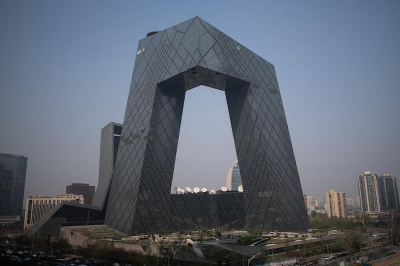 The CCTV tower in the central business district is pictured in Beijing on April 4, 2019. - China has unveiled tens of billions of dollars worth of tax and fee cuts as part of a drive to kickstart the stuttering economy, extending pledges worth $300 billion announced last month. With growth at a near three-decade low and the economy struggling under the weight of the US trade row and a soft global outlook, leaders are looking to grease the cogs by getting the country's vast army of consumers to start spending. (Photo by FRED DUFOUR / AFP)